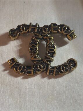Gold and Black Interlocking CC Logo Lettering Brooch